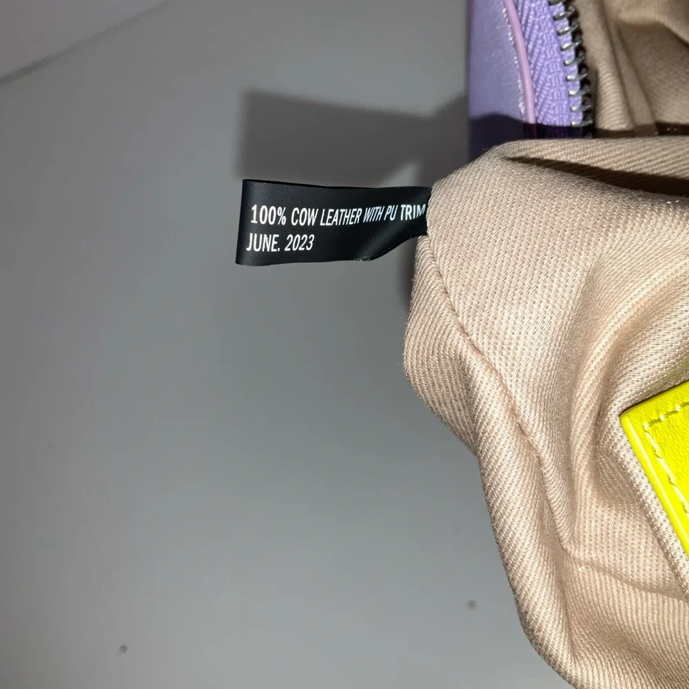DKNY Essex Saffiano 100% Cow Leather Shoulder Bag in a purple colorway